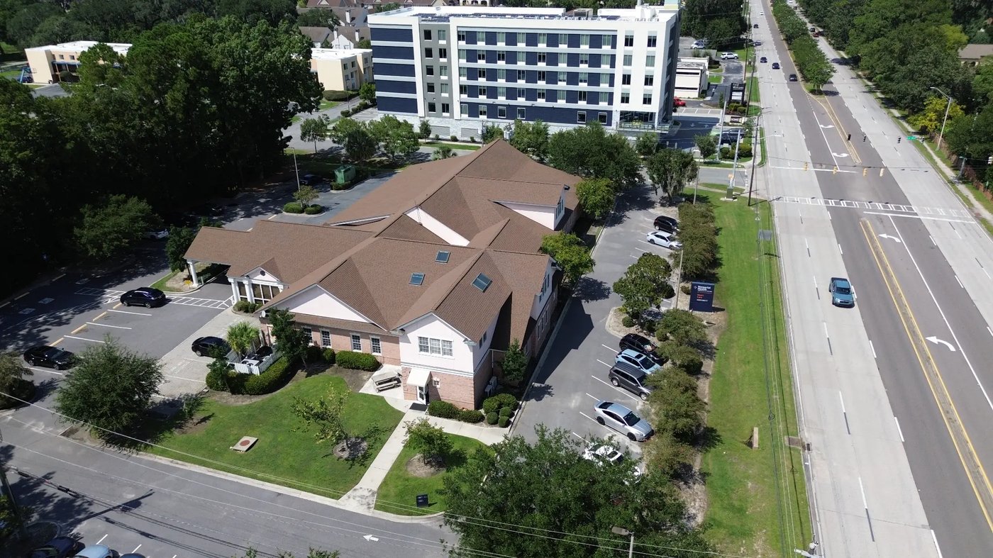 Close aerial of The Cardiology Building and parking
